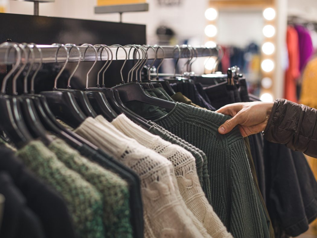 Retail shopping, clothes on hangers