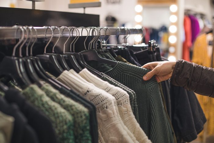 Retail shopping, clothes on hangers